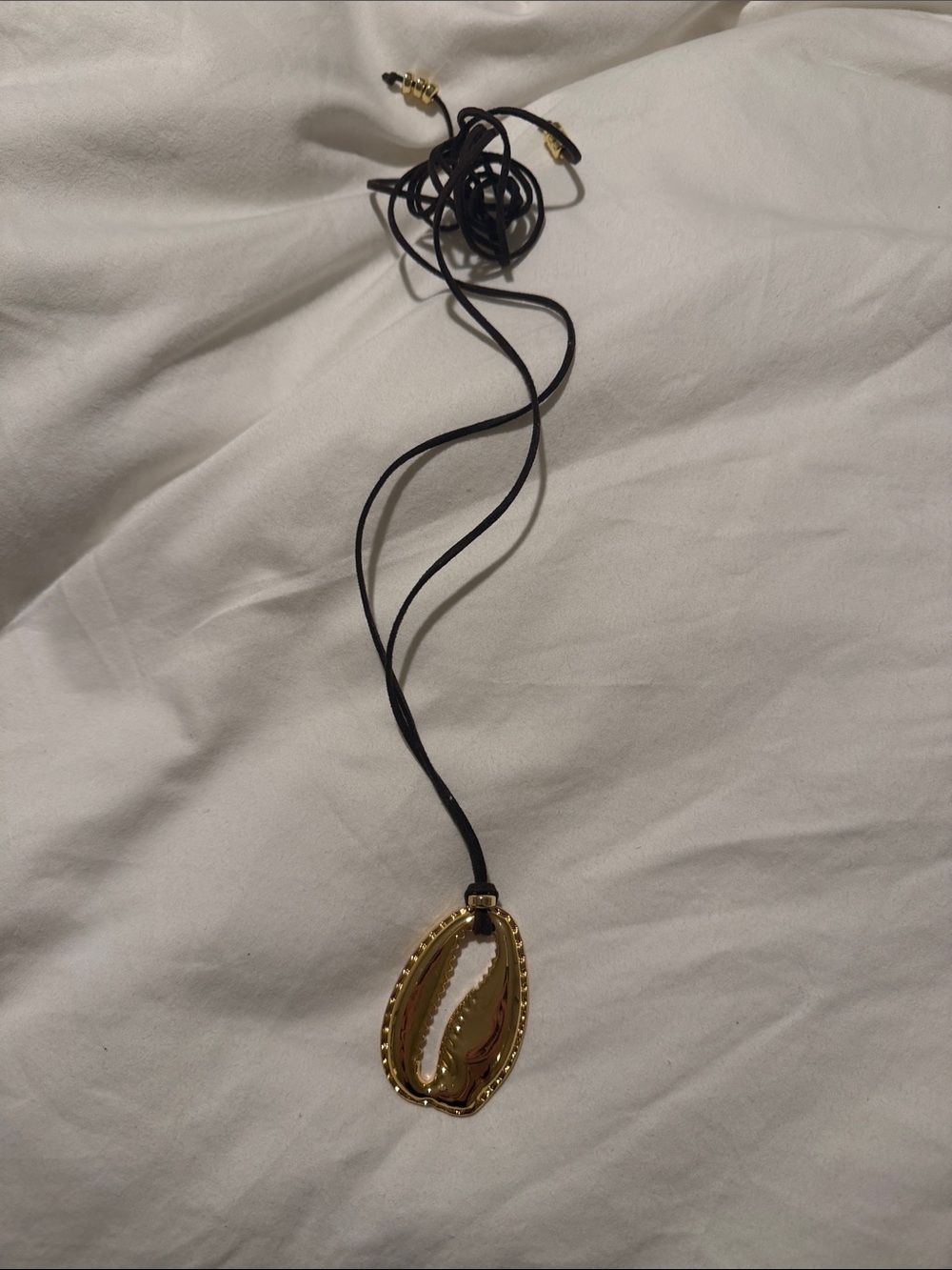 Eliou Gold Cowrie Shell Pendant on Black Cord